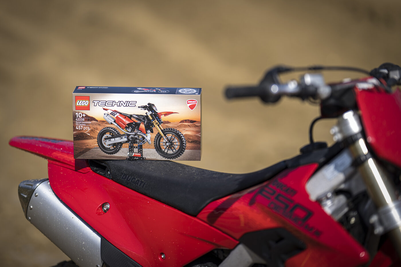 LEGO Technic Ducati Desmo450 MX Factory set box on a Ducati motocross bike